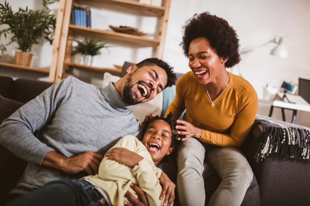 family laughing together in living room