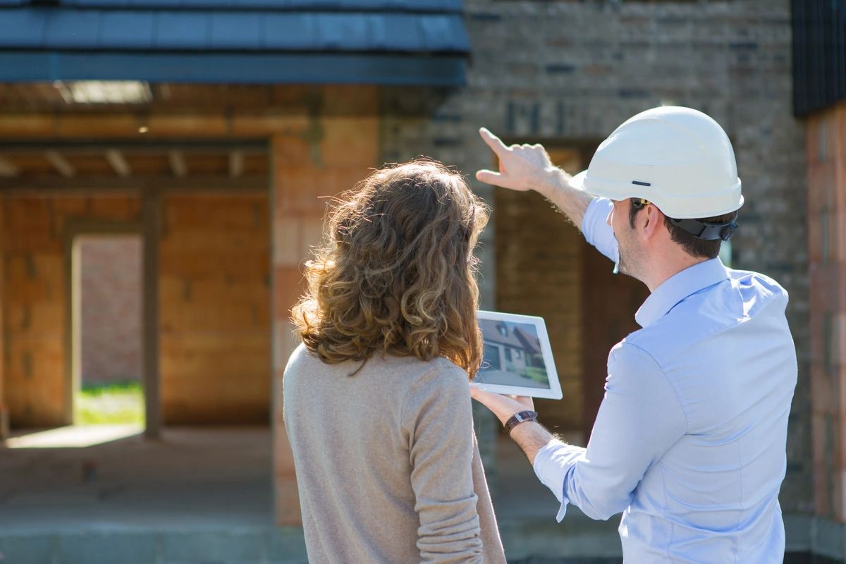 Contractor talks to a homeowner about the renovation plans