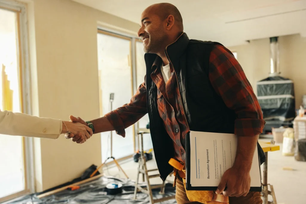 Contractor shaking hands during interior remodel